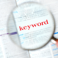 a magnifying glass over the word "keyword" in red